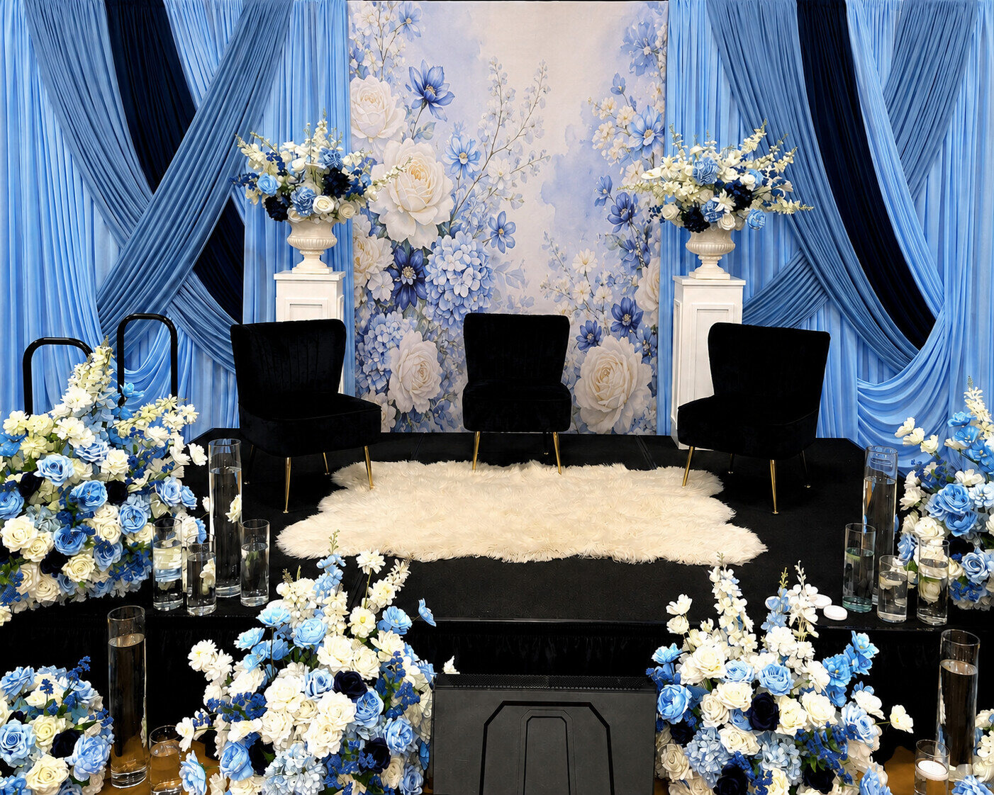 Blue luxury drapery, florals, and black lounge seating styled by LOL Creative Events